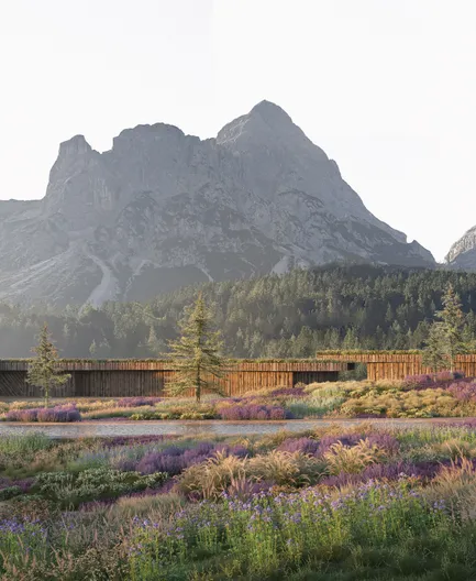 Architekturvisualisierung: Langgestreckter Holzbau in Wildblumenwiese unter Alpengipfeln