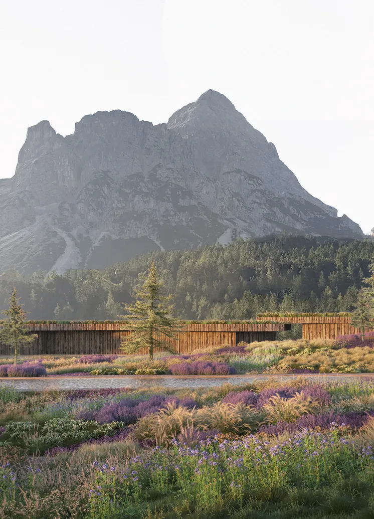 Architekturvisualisierung: Langgestreckter Holzbau in Wildblumenwiese unter Alpengipfeln