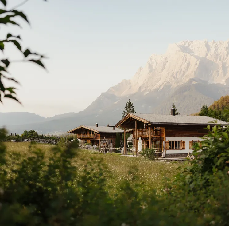 LaPosch Living Lands chalets in the alpine meadow with Zugspitze panorama